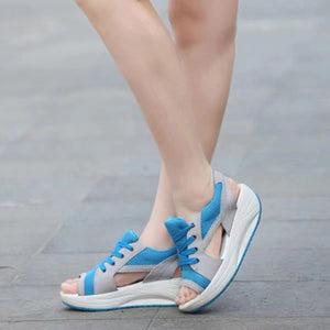 Blue and gray lace-up wedge sandals with breathable mesh and adjustable straps.