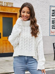 White cable-knit acrylic sweater with a choker neckline and relaxed fit.