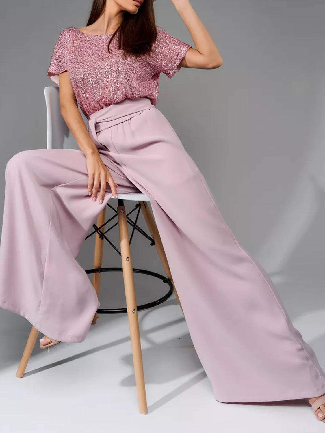 Dusty pink palazzo pants with a sequin bodice top.