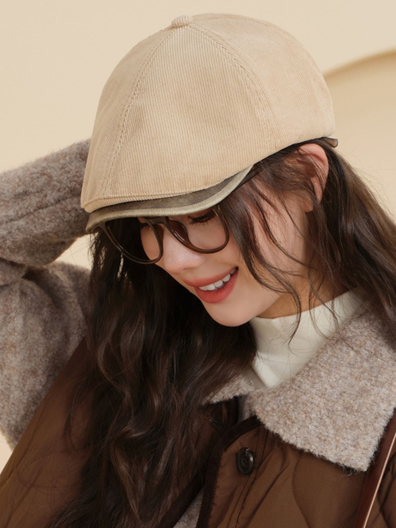 Vintage corduroy newsboy hat in camel, classic casual accessory for adults.