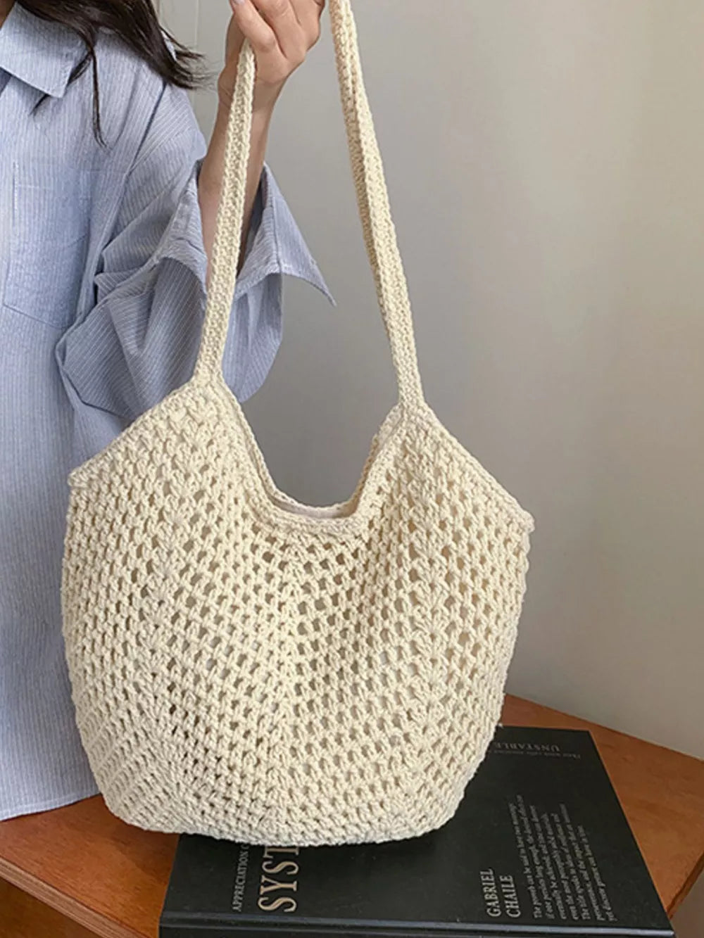 Chevron woven straw shoulder bag in Rice White with braided straps and open crochet detail.