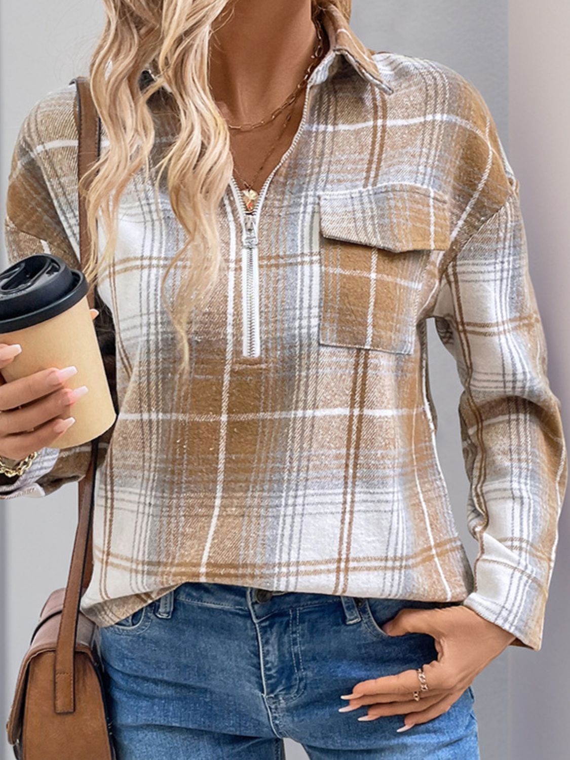 Plaid zip-through shirt in camel with chest pocket and collared neckline.