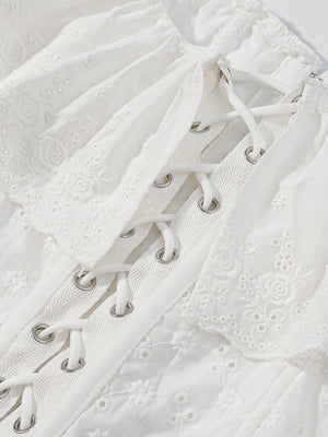 White eyelet tank top with ruffle trim and corset lace-up detail