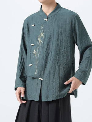 Green embroidered mandarin collar men's shirt with bamboo detail and frog buttons.