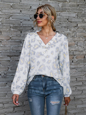 Light gray leopard print henley blouse with blouson sleeves and button detail