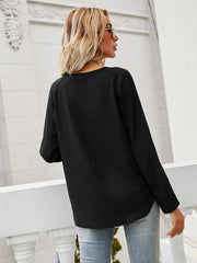 Black lace-inset blouse with slit sleeves and curved hem