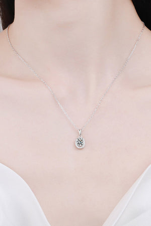 Silver halo moissanite pendant necklace on a delicate chain, crafted from 925 sterling silver.