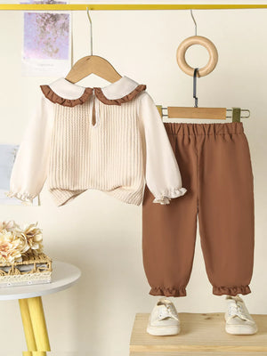 Baby girls tan floral applique ruffle two-piece set with knit top and pants.