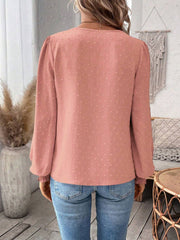 Pink purple textured blouse with puff sleeves and embroidered yoke detail.