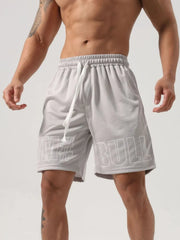 Gray mesh gym shorts with white graphic print and drawstring waist.