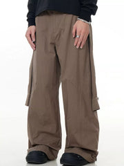 Earthy brown wide-leg cargo pants with buttoned flap pockets and full swing cut.