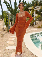 Terracotta open knit maxi dress with bell sleeves and square neckline.
