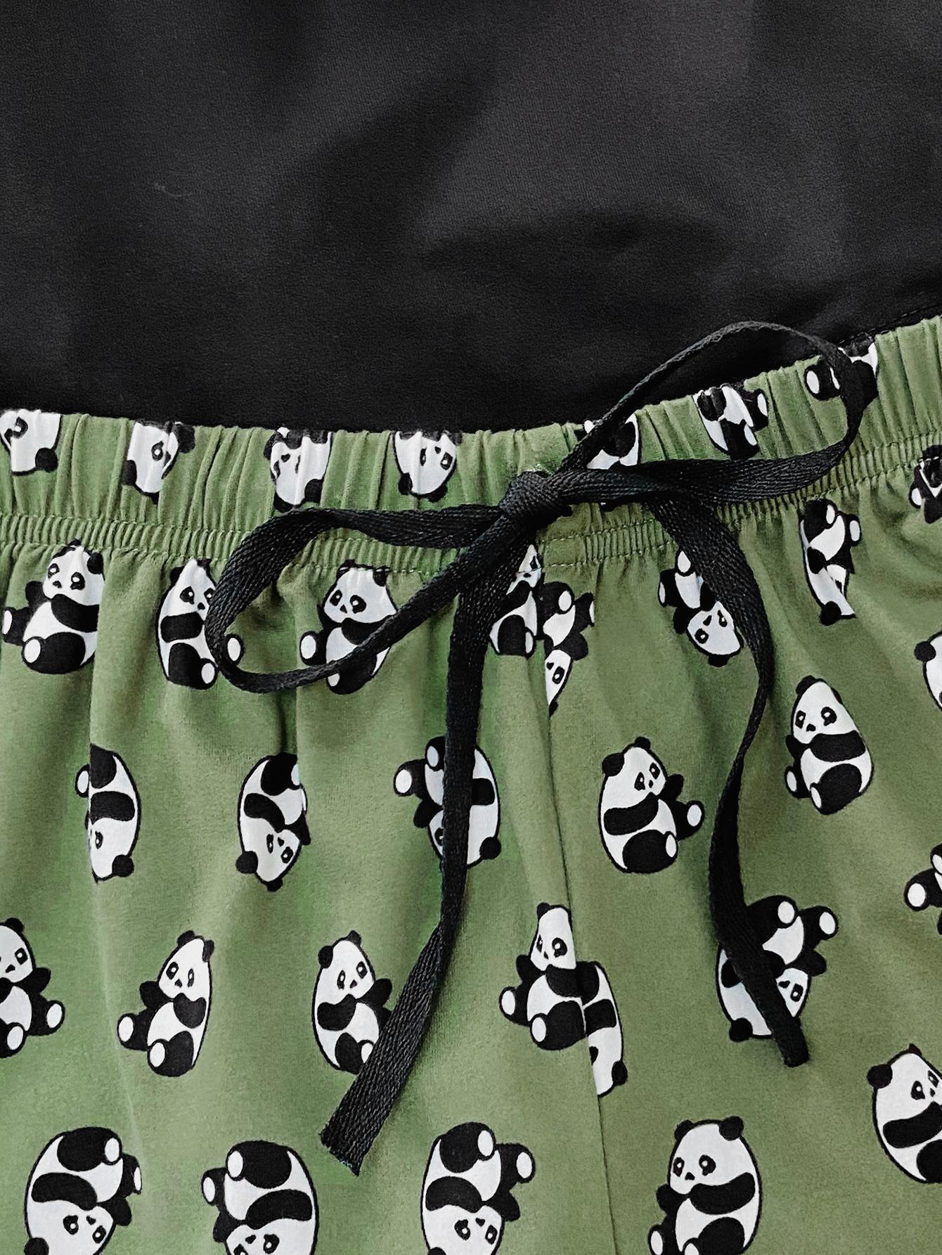 Green panda print pajama shorts with drawstring and black top detail.