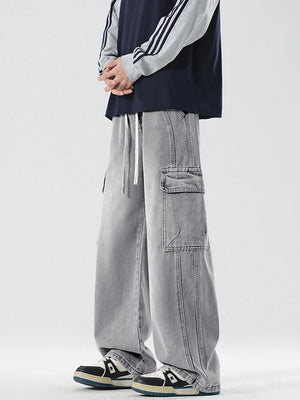 Light Gray oversized cargo jeans with drawstring waist and large side pockets.