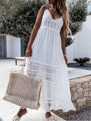 White crochet cami dress with tiered lace and tassel trim, V-neck, spaghetti straps.