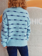 Pastel blue crew neck sweater with textured stripe pattern and ribbed cuffs.