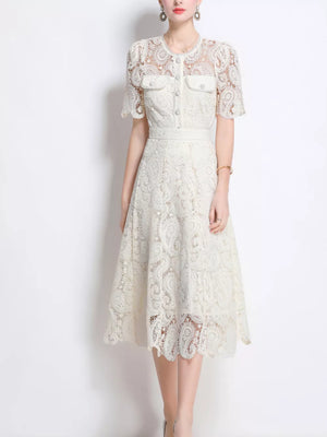 White lace buttoned midi dress with short sleeves and pocket details.