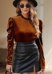 Brown velvet blouse with gathered puff sleeves and mock neck