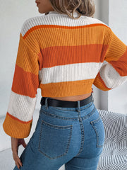 Striped acrylic crop sweater with balloon sleeves in tangerine and white.