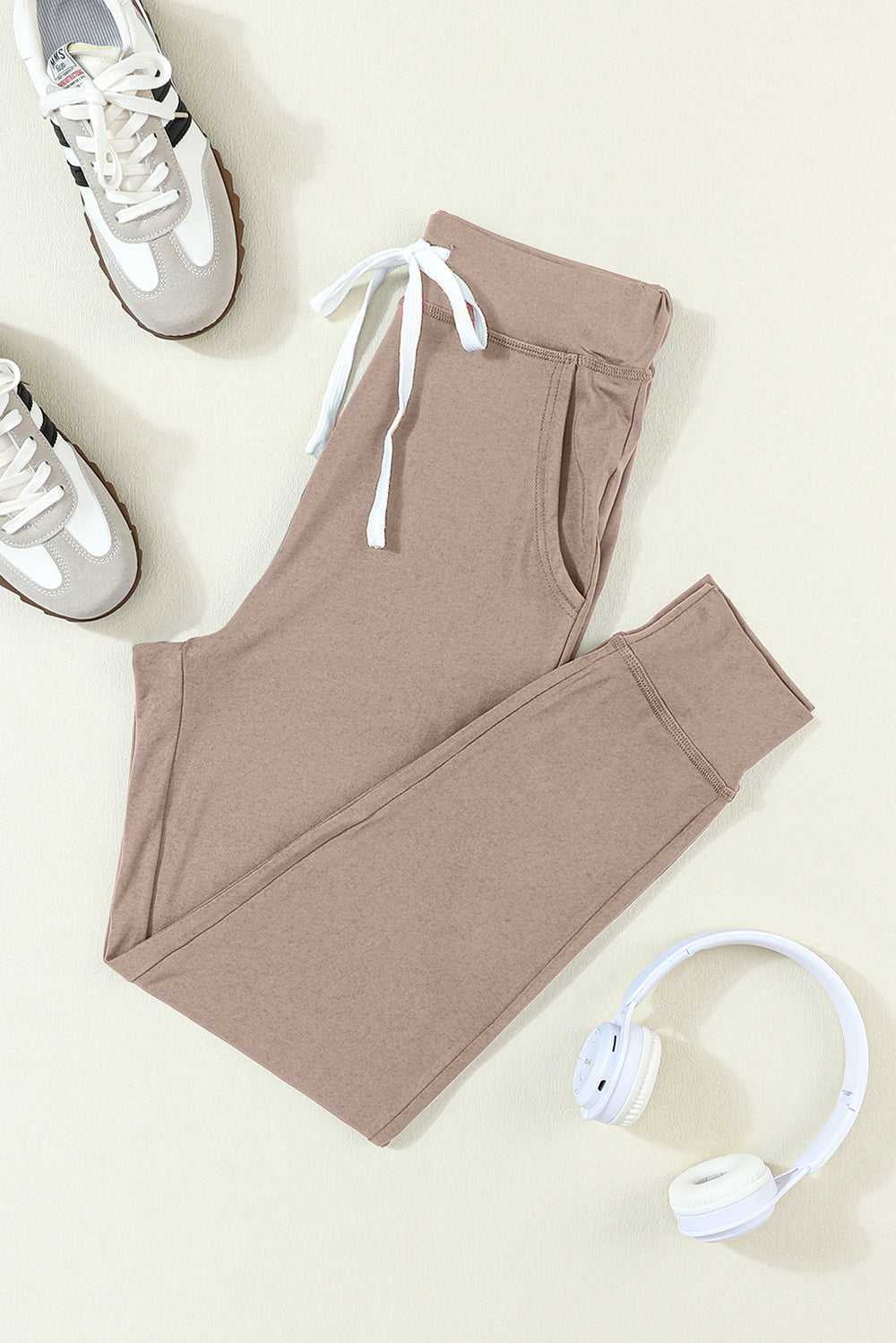 Mocha slim-fit lounge joggers with white drawstring and cuffed ankles.