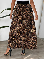 Leopard print maxi skirt with knife pleats and a black waistband.