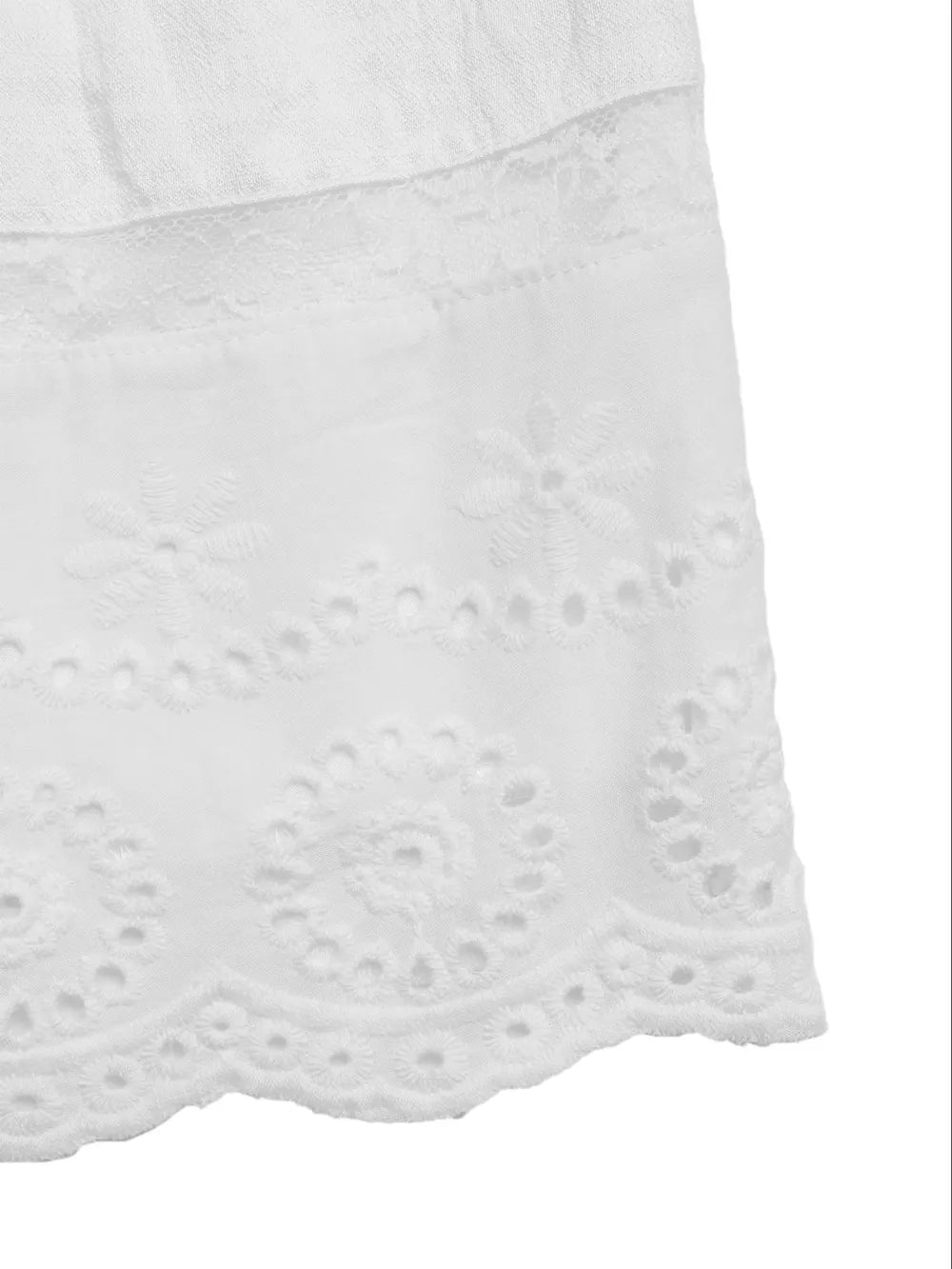 White smocked mini dress with eyelet lace hem detail