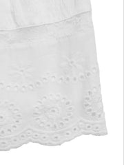 White smocked mini dress with eyelet lace hem detail