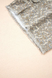 Denim shorts with leopard print and frayed hem detail.