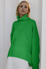 Green oversized cashmere turtleneck sweater with ribbed collar and cuffs.