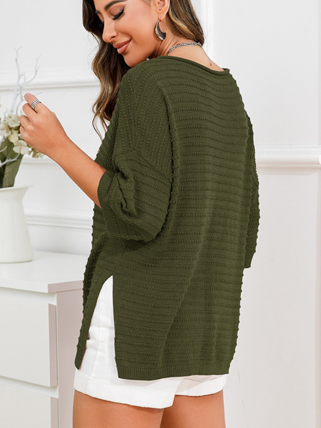 Army green textured knit sweater with boat neck and slit hem