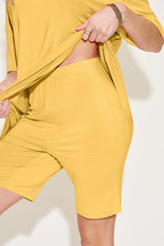 Yellow bamboo loungewear set with relaxed fit tee and bike shorts.