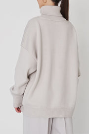 Light Gray relaxed roll-neck sweater with a boxy knit and ribbed cuffs and hem.