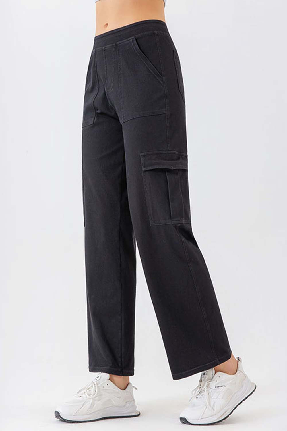 Black utility denim cargo pants with multiple pockets and a relaxed fit.