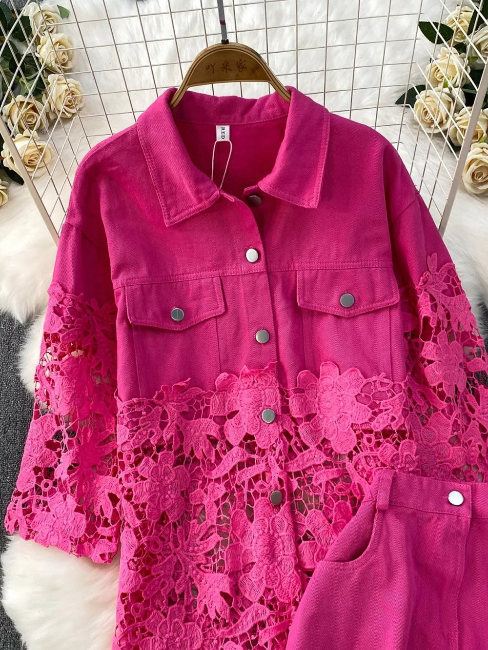 Rose red two-piece set with lace-embellished jacket and shorts.
