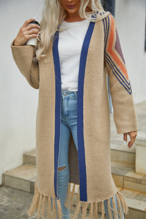Khaki long cardigan with blue trim and geometric sleeve detail, fringed hem.