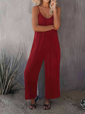 Burgundy gathered bodice wide-leg jumpsuit with spaghetti straps and a flowy silhouette.