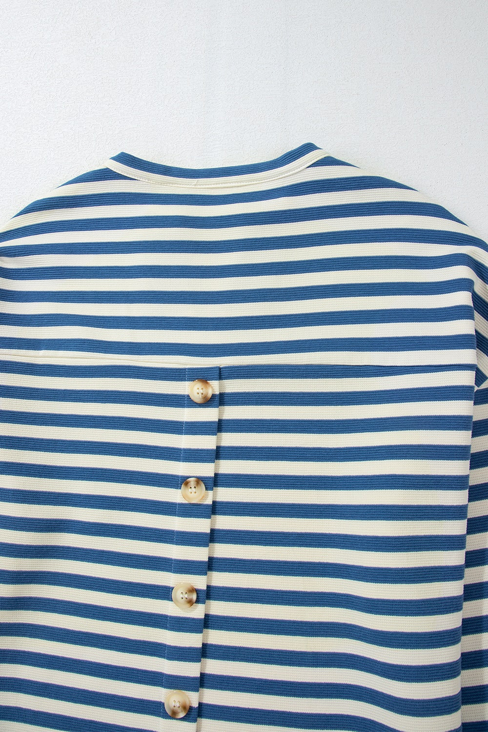 Peacock blue striped henley top with button detail on back