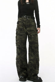 Oversized camo utility cargo pants with multiple pockets and a black belt.