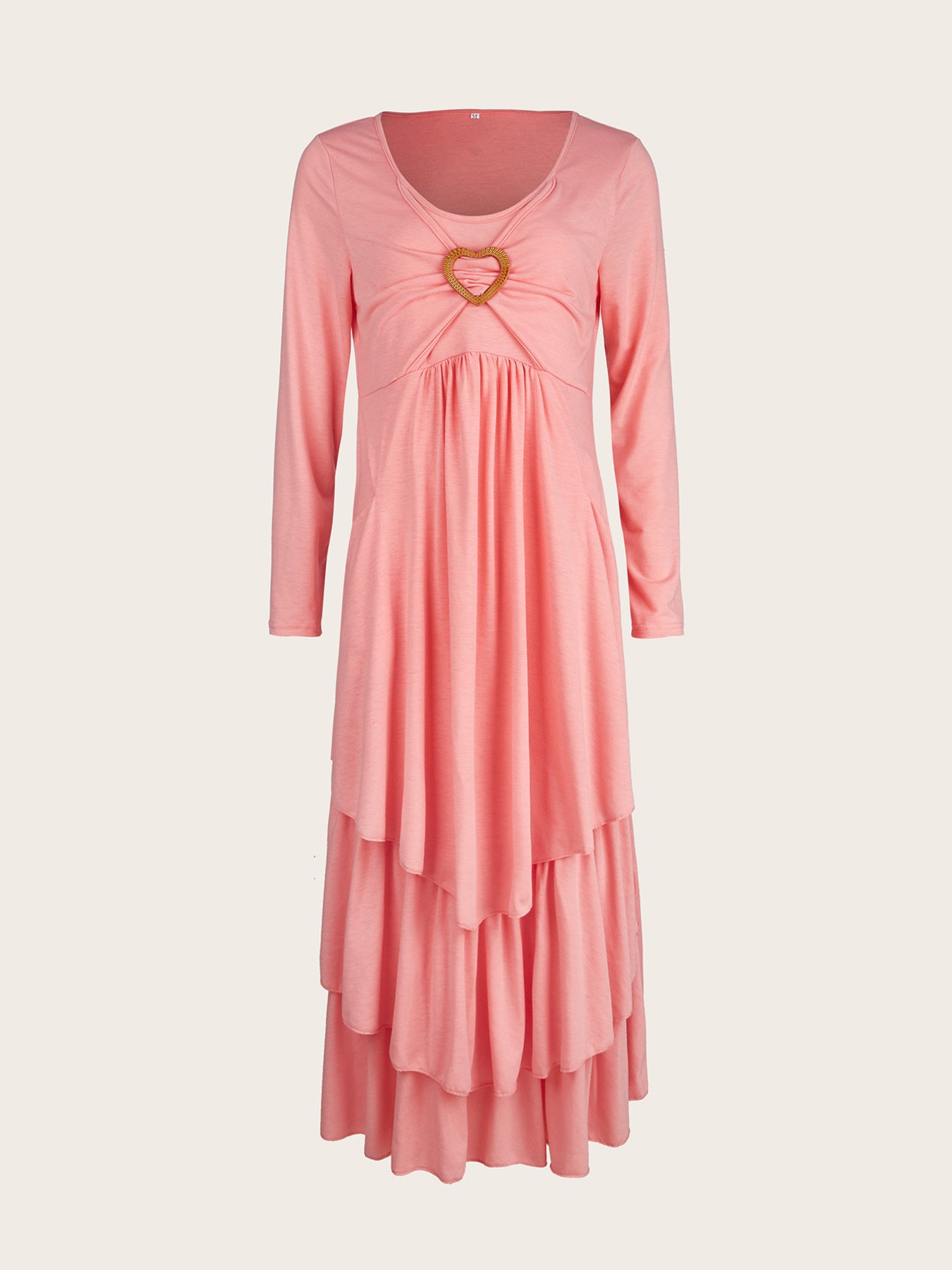 Pink tiered midi dress with long sleeves and a heart detail at the neckline.