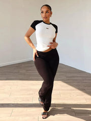 Chic contrast two-piece set with a white short-sleeve tee and black pants.