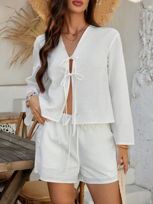 White linen tie-front top and shorts set with drawstring waist and v-neckline.