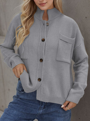 Gray acrylic knit cardigan with stand collar, buttons, and chest pockets.