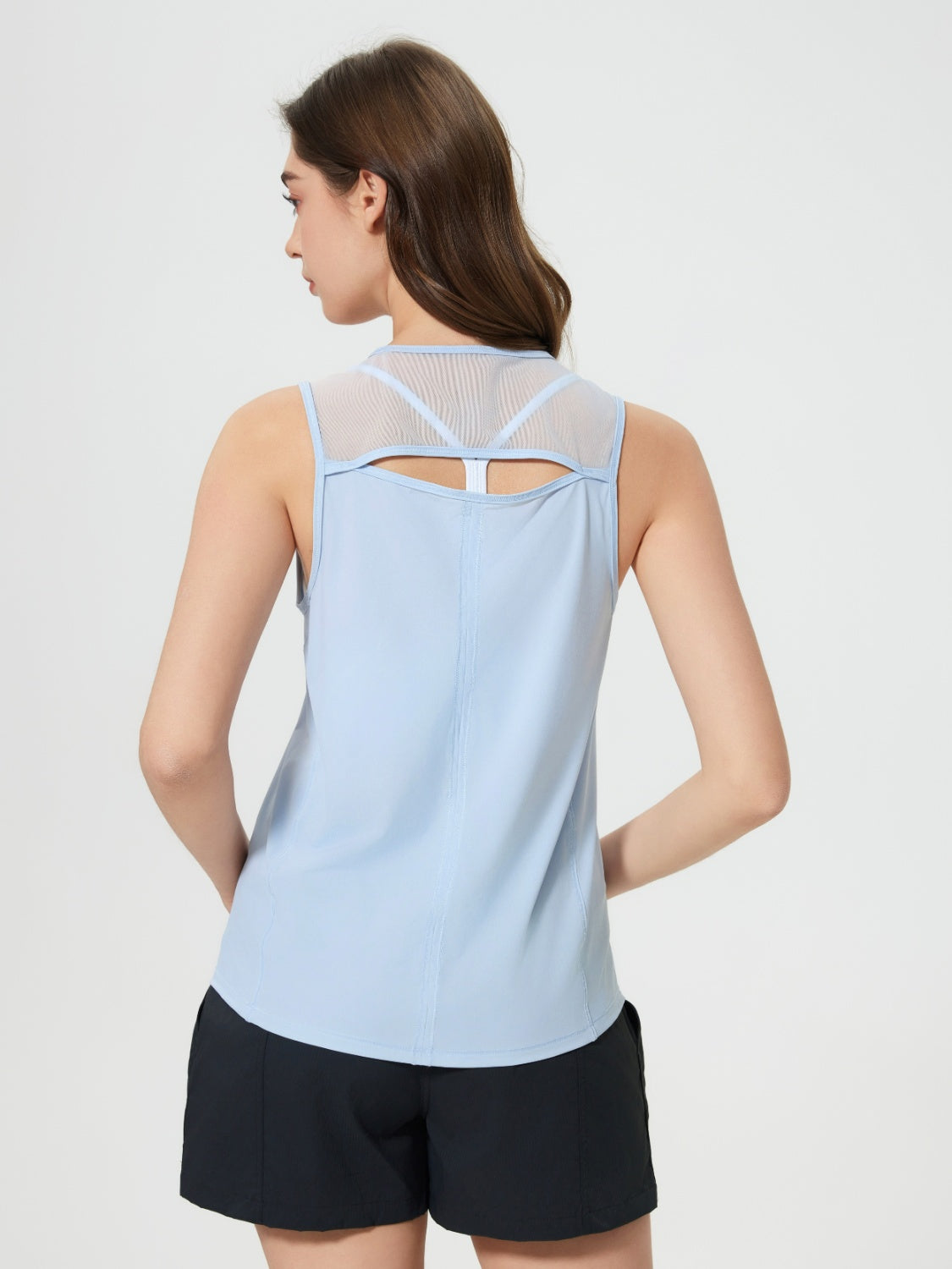 Light blue mesh-back performance tank top with a cutout detail on the back.