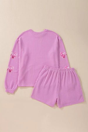 Purple seersucker two-piece outfit set with sequin bow details on sleeves.