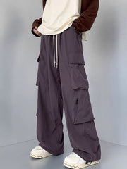 Men's mauve cargo sweatpants with drawstring and zippered pockets.