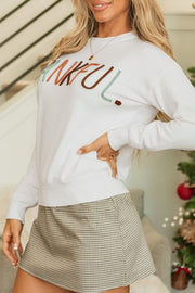 White drop shoulder sweater with "Thankful" embroidery, crew neck, long sleeves.