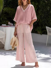 Pink striped V-neck top with white trim and wide-leg pants set