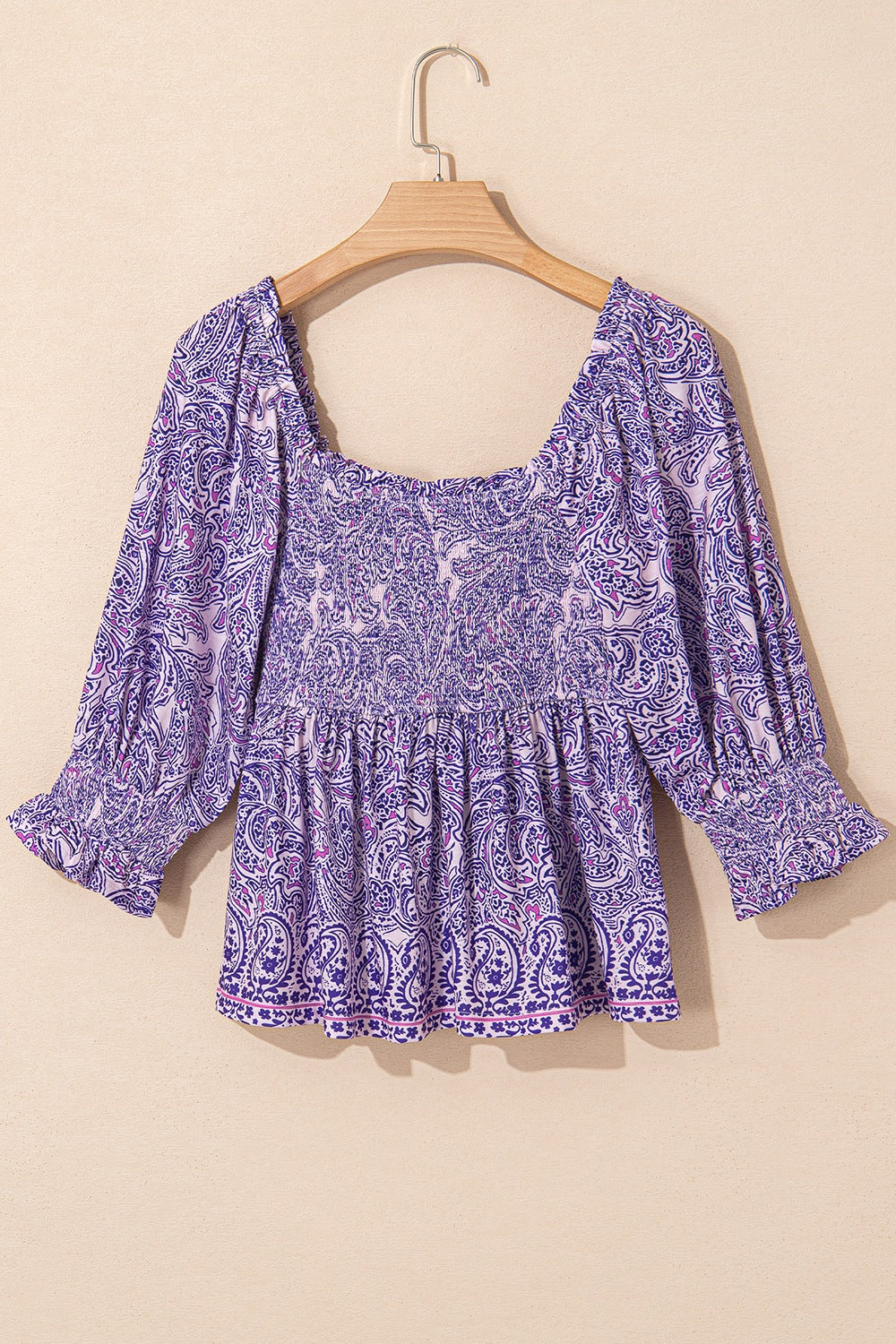 Paisley smocked bodice blouse in lavender with square neck and ruffled cuffs.