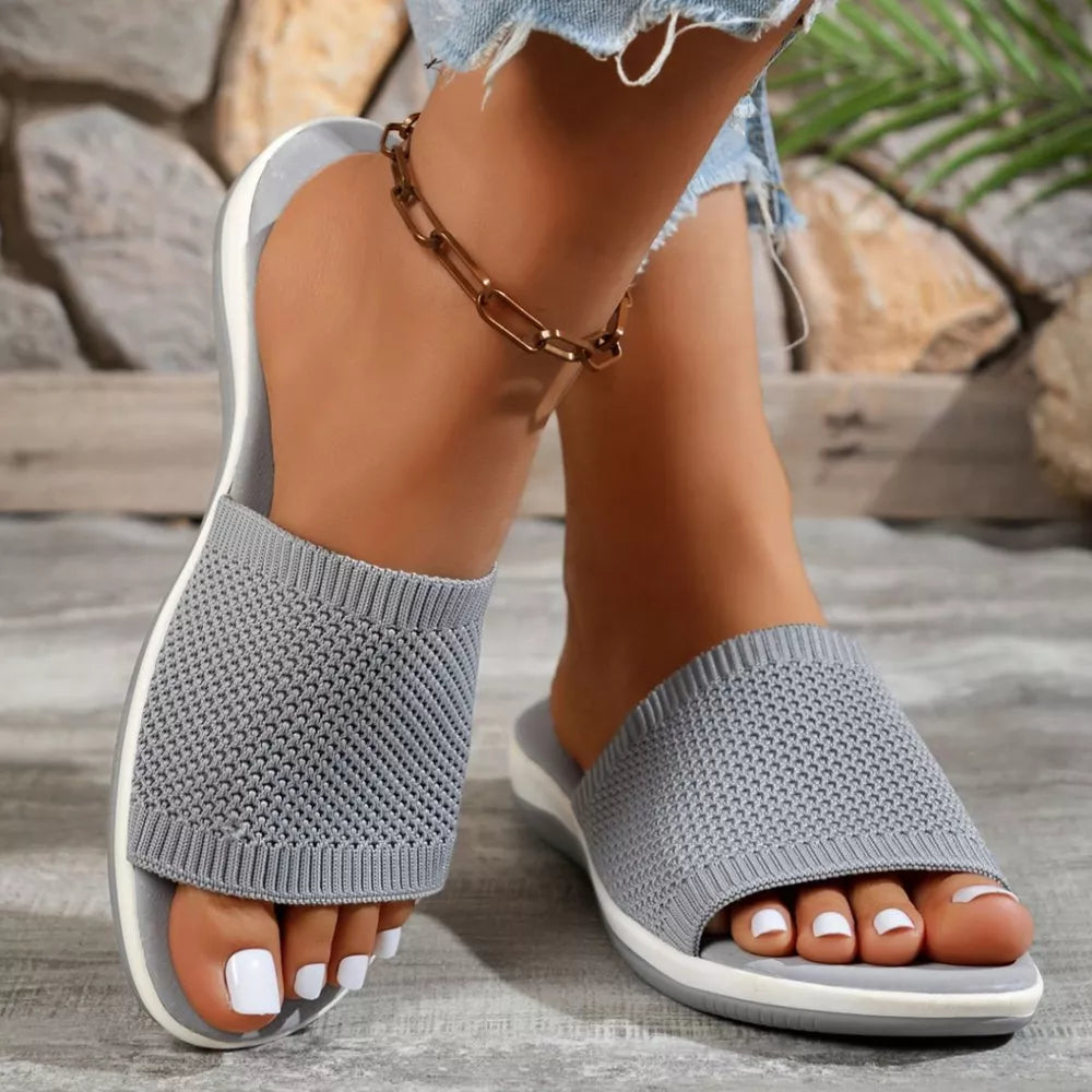 Gray open-toe knit slip-on sandals with a comfortable casual style.