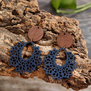 Dusty blue laser-cut wooden drop earrings with boho floral pattern and copper hooks